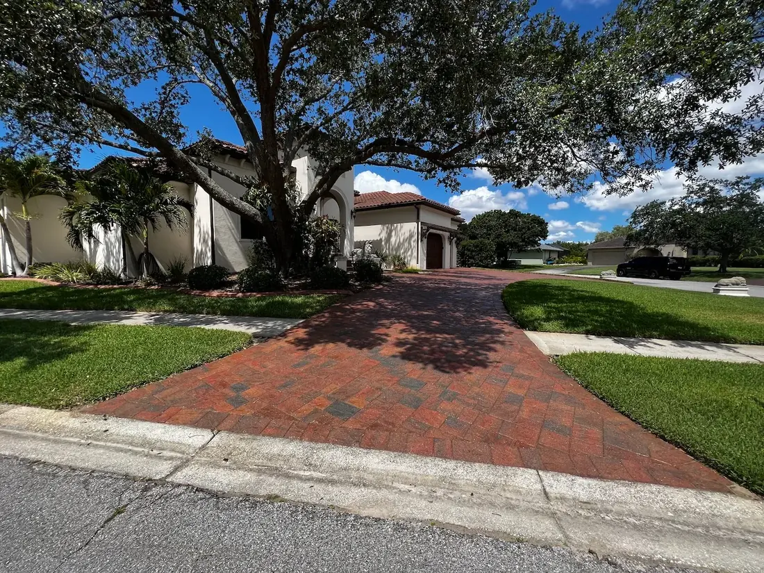 Newly sealed paver driveway enhancing curb appeal in a Palm Harbor, Florida home