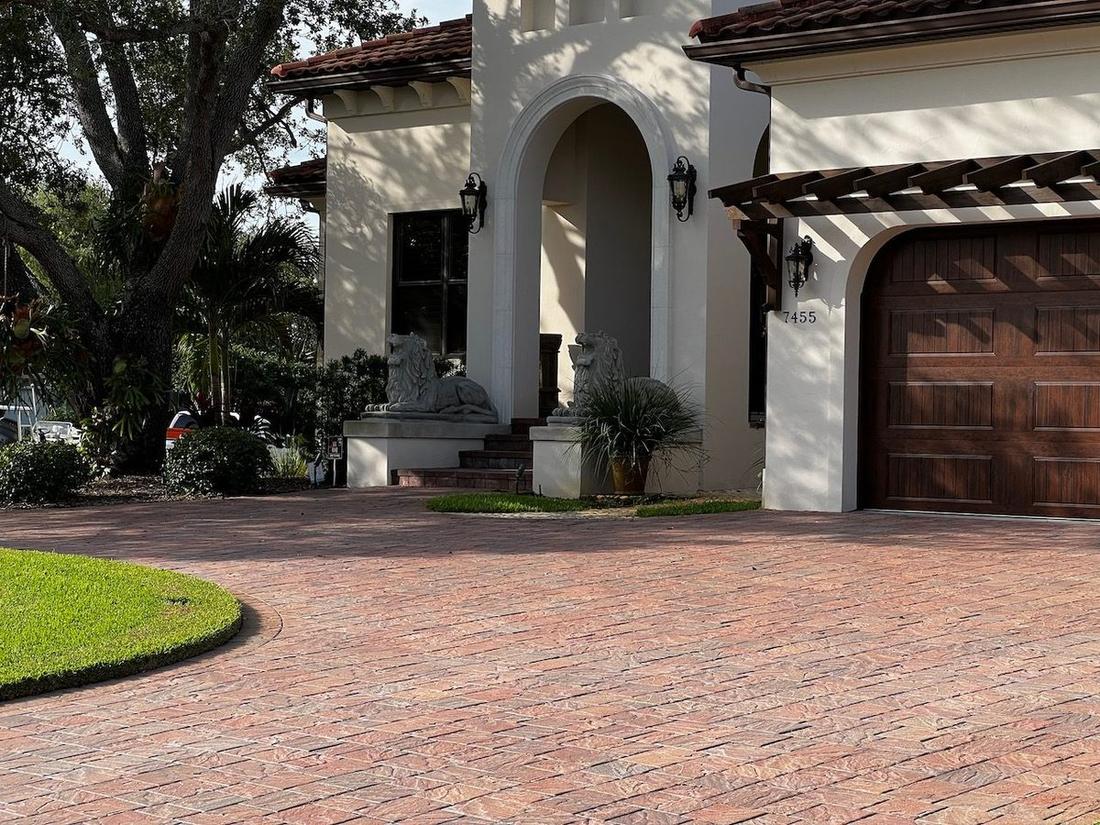 Restored paver pool deck cleaned and sealed around a Pinellas County pool