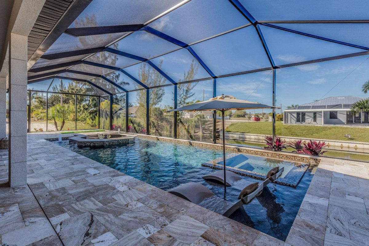Screened pool enclosure cleaned of dirt and mildew at a St. Petersburg home