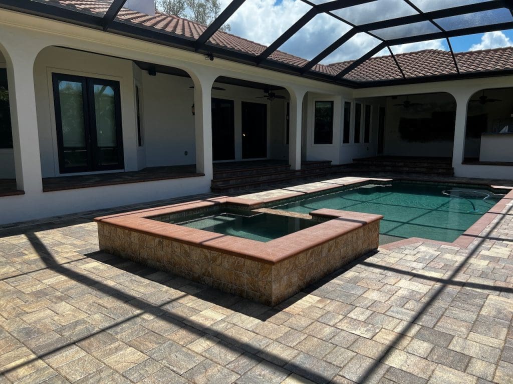 Pool deck with built-in hot-tub in Clearwater, Florida, beautifully maintained with paver sealing